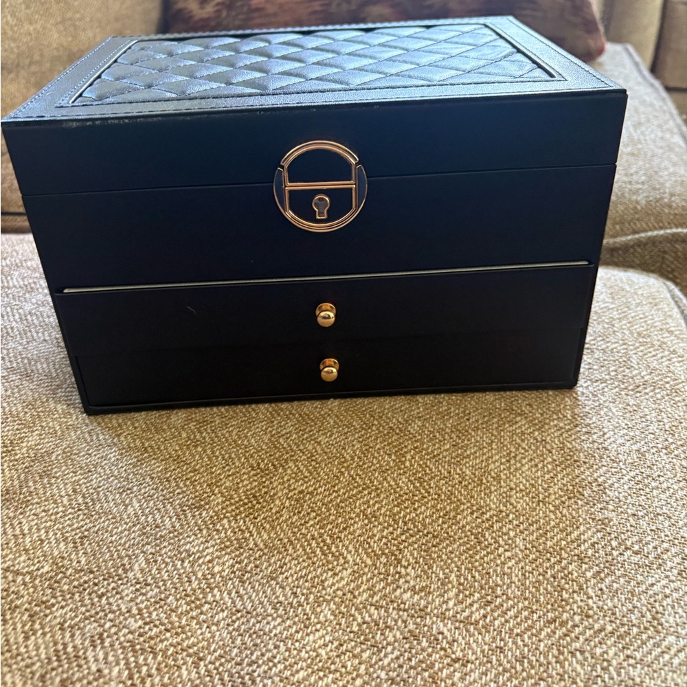 Large jewelry box filled with jewelry